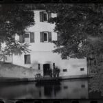 Historic building by a calm water
