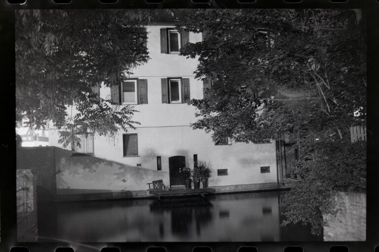Historic building by a calm water